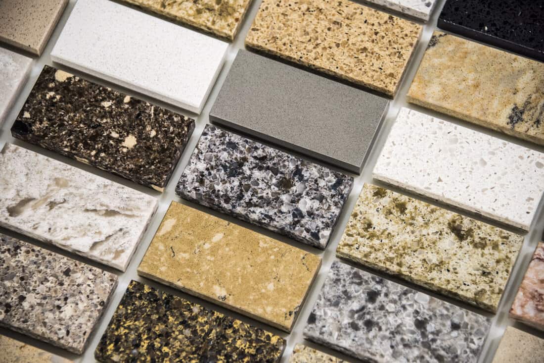 Natural stone granite slabs used for countertops, some are porous than others - an embodiment of kitchen remodeling concept.
