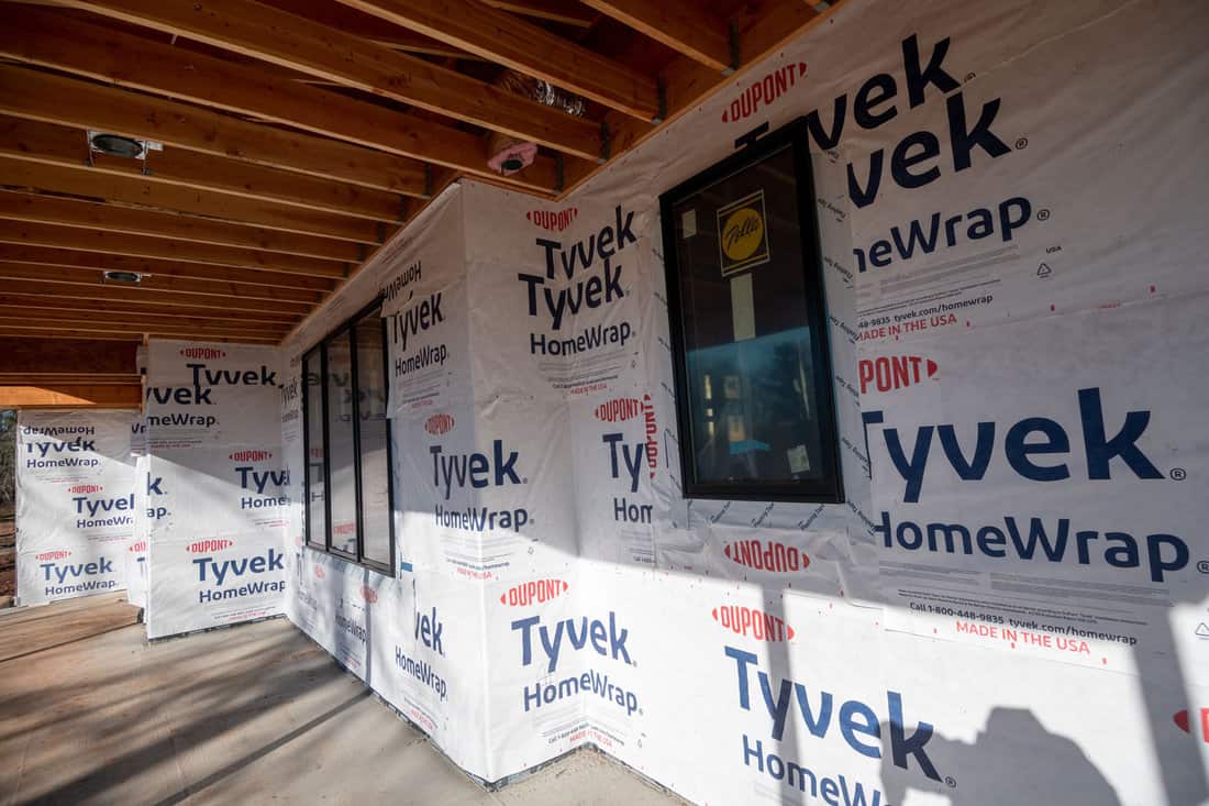 The exterior of the residence covered with Tyvek home wrap.