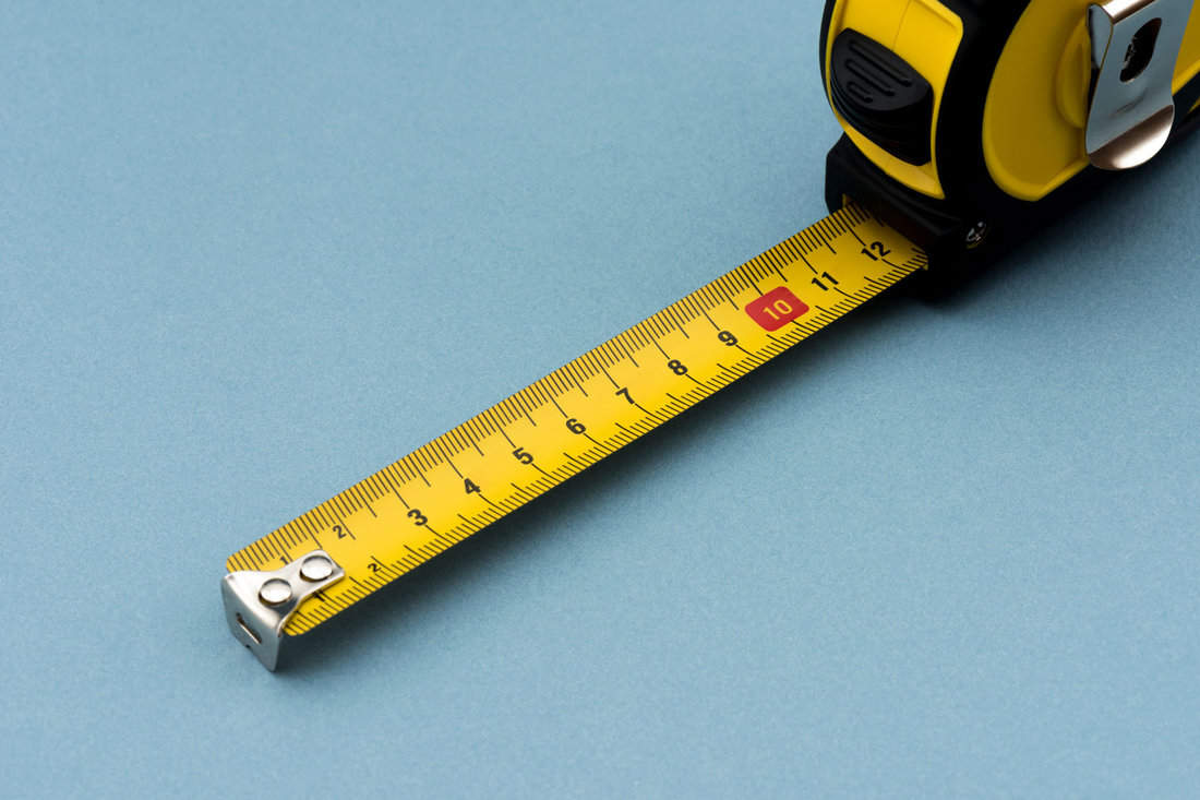 Tape measure on a blue wall
