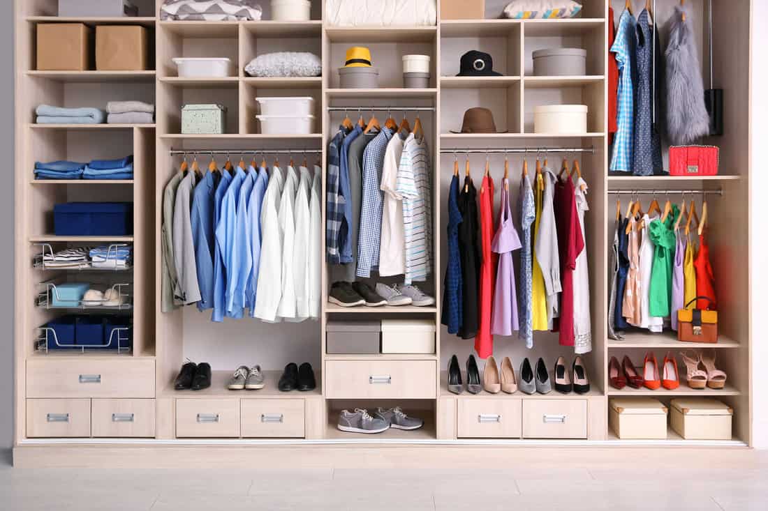 Modern closet with lots of folded and hanged cloths