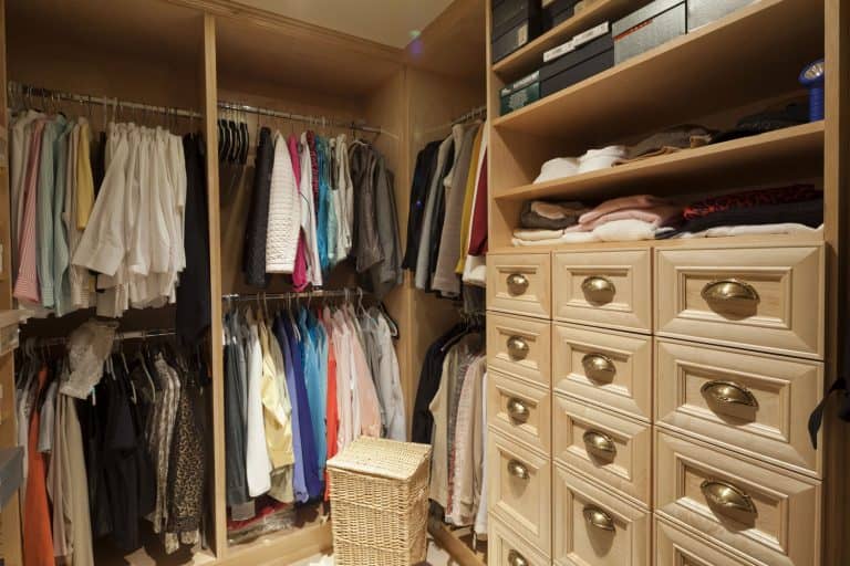 Interior of a modern closet filled with lots of clothes