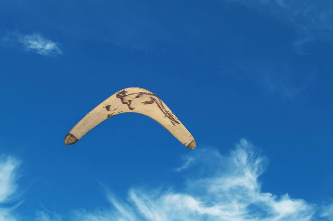 A boomerang flying on a wall