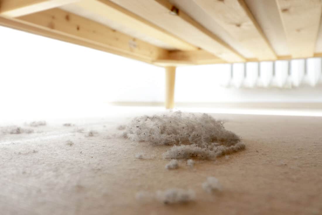 Dust and dirt accumulating underneath the bed