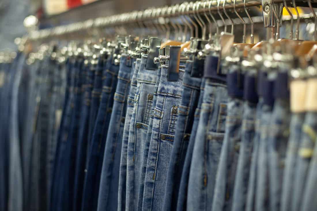 Properly hanged jeans inside a closet