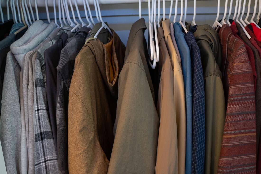 Hanged coats inside a closet