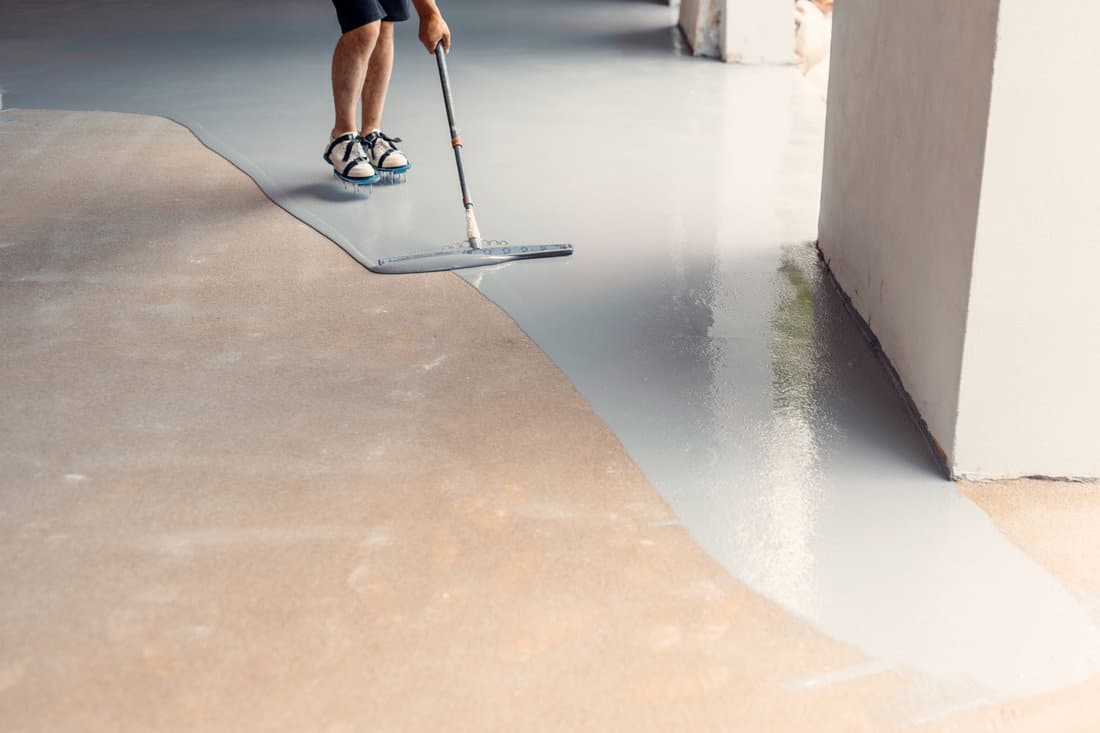 Applying garage floor coating
