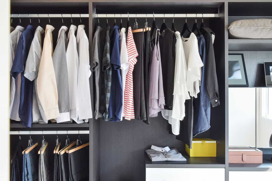Modern closet filled with hanged cloths