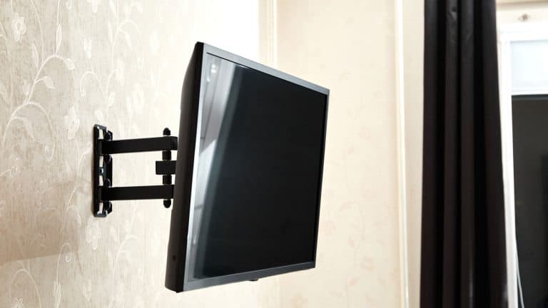 A wall mounted TV in the living room, How To Hang A Besta TV Unit On The Wall: Simple Wall Mounting Guide - 1600x900