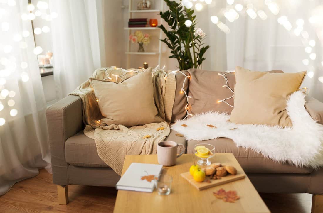  Cozy living room with fairy lights and warm decor.