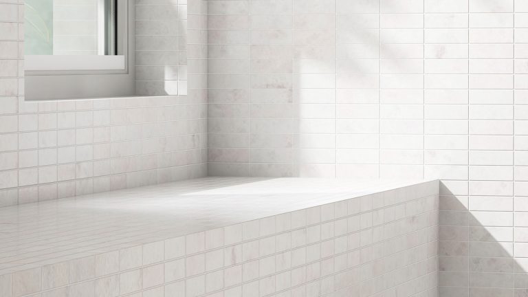 A white shower bench inside a shower room, Should A Shower Bench Install Be Before Or After The Pan? - 1600x900