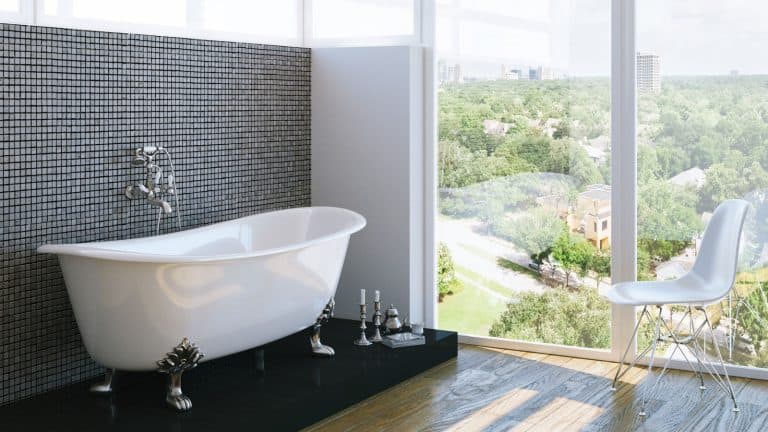 Interior of an ultra modern bathroom with a bathtub and an over view of a city, What Size Tub Is Best For A 6 Foot Tall Person? - 1600x900