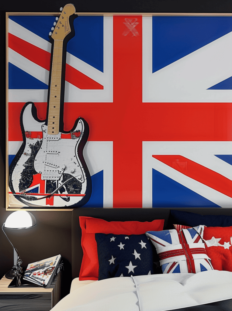 A lively bedroom setting with a prominent wall art of a guitar superimposed on the Union Jack, complemented by a bed graced with red and navy pillows, some with stars and one with the Union Jack motif, next to a bedside table featuring a lamp and a stack of magazines ar 3:4