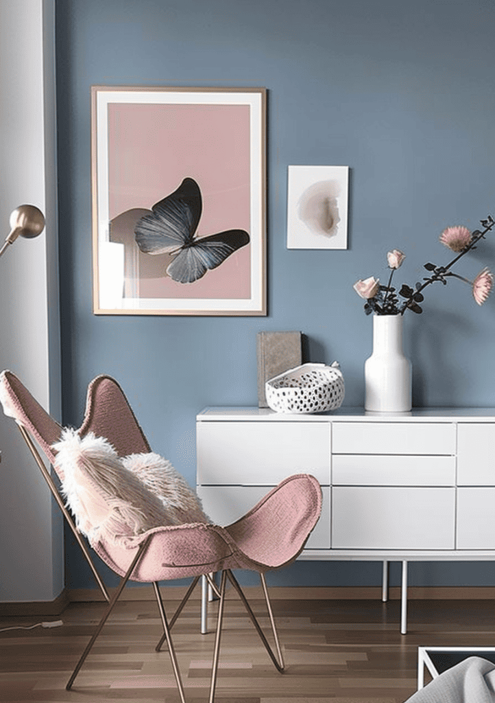 Scandinavian style corner. With soft blue walls, a dusky pink butterfly chair, and gold accents. White modern sideboard and large contemporary monochrome artwork leaning against the wall ar 3:4