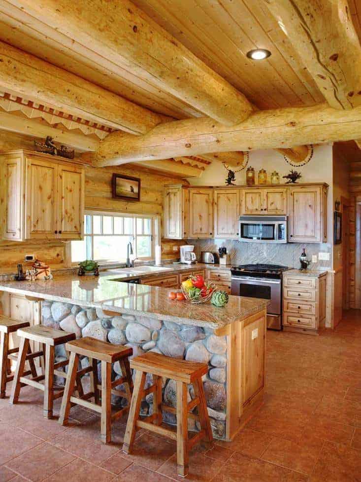 Rustic Kitchen making use of stone and wooden logs for a primitive style feel