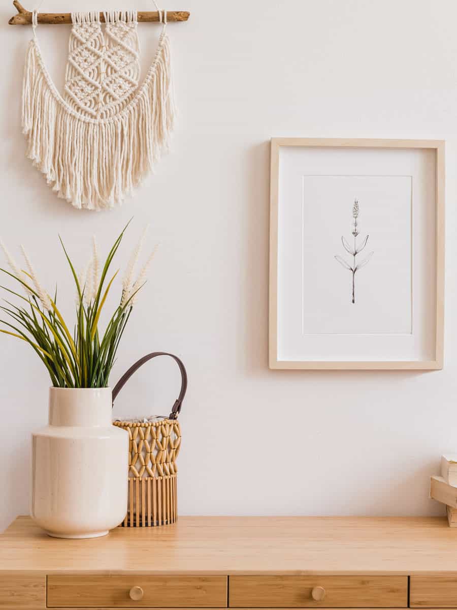 Macrame and a small wooden framed canvas hanged on the wall