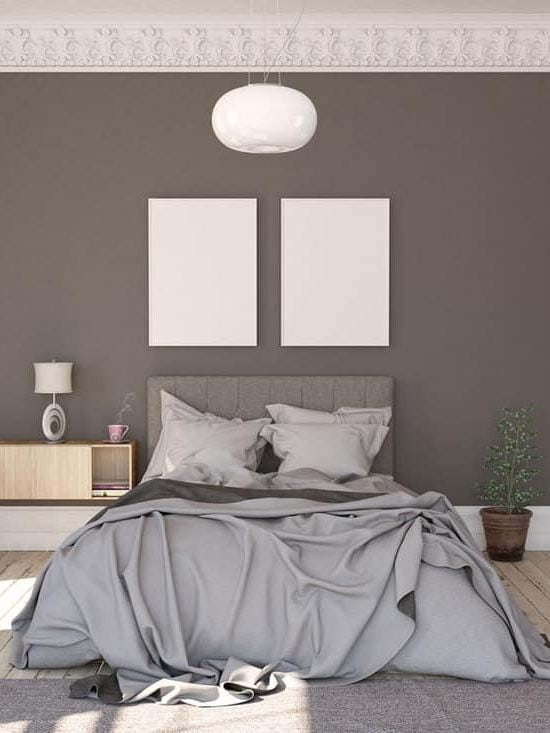 A gray bedroom with a gray bed