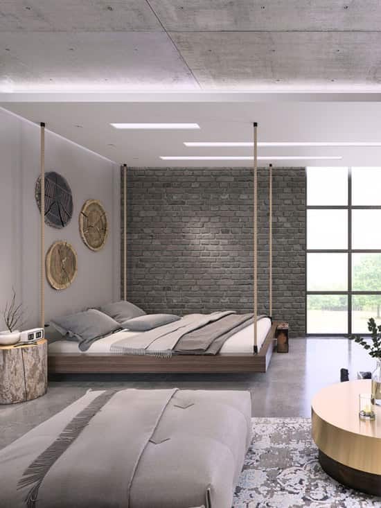 A modern gray themed bedroom with a white bed and a huge window