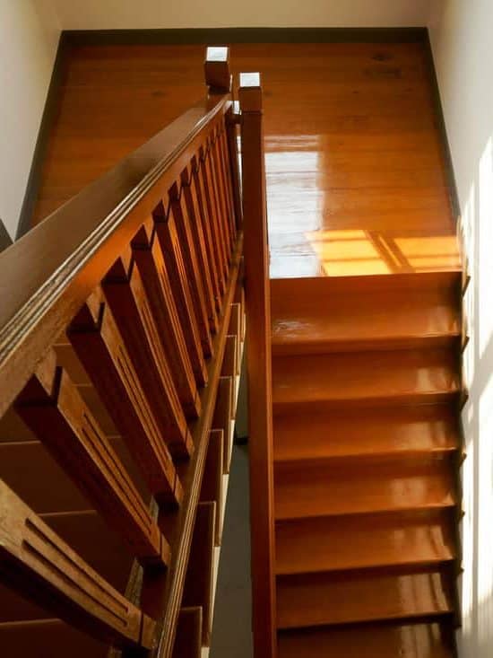 Brown wooden stair interior decorated modern style of residential house,Wooden stairs in the house, looking down. 