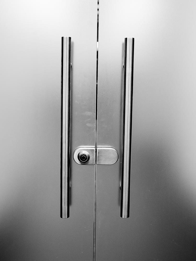 Glass frosted door with a metal handle